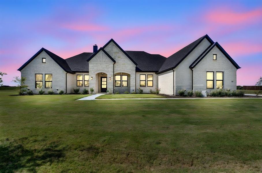 Front exterior of a new home in Springside Estates II, Waxahachie, TX, highlighting curb appeal (Image 2).