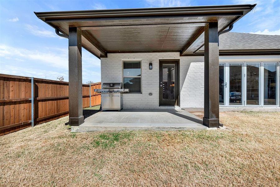 Exterior details and patio area of a home in Woodstone, Providence Village (Image 23). Exterior details and patio area of a home in Woodstone, Providence Village (Image 23).