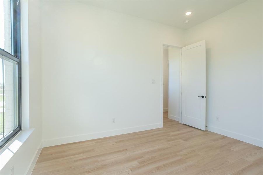 Spare room with light hardwood / wood-style floors