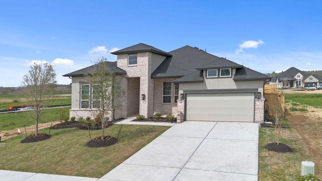 Front exterior of a new home in Briarley, Montgomery, TX, highlighting curb appeal (Image 23).