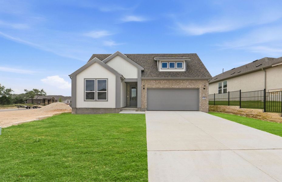Front exterior of a new home in Sun City Texas, Georgetown, TX, highlighting curb appeal (Image 19). Front exterior of a new home in Sun City Texas, Georgetown, TX, highlighting curb appeal (Image 19).
