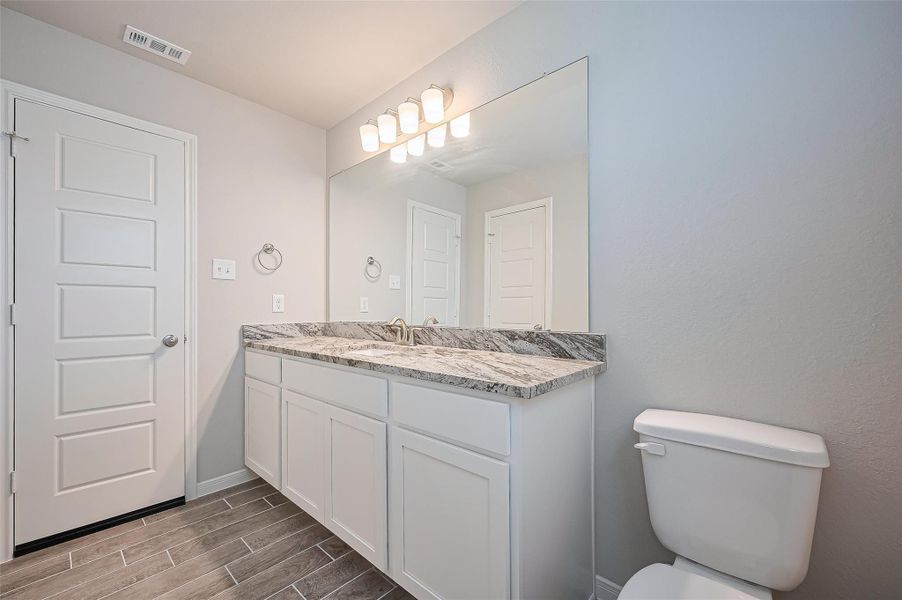 Furnished interior view inside a new home in Sunterra, Katy (Image 17).