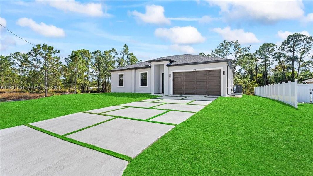 Front exterior of a new home in , Lehigh Acres, FL, highlighting curb appeal (Image 22). Front exterior of a new home in , Lehigh Acres, FL, highlighting curb appeal (Image 22).