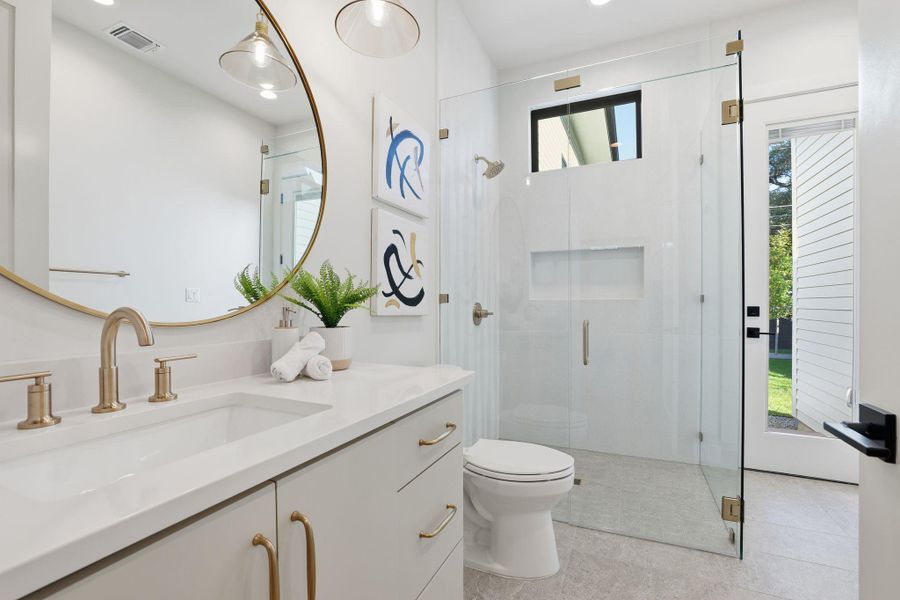 Full bathroom with a shower stall, vanity, light tile patterned floors, and recessed lighting