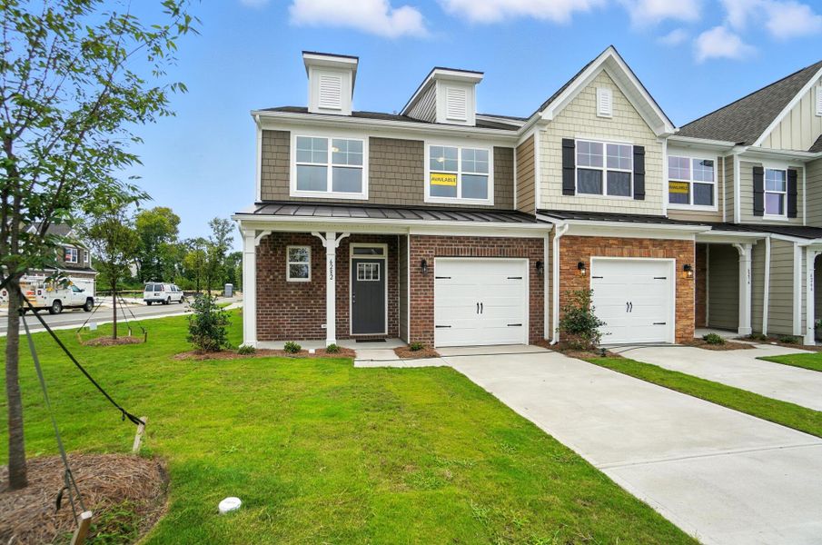 Front exterior of a new home in Harrisburg Village Townhomes, Harrisburg, NC, highlighting curb appeal (Image 26). Front exterior of a new home in Harrisburg Village Townhomes, Harrisburg, NC, highlighting curb appeal (Image 26).