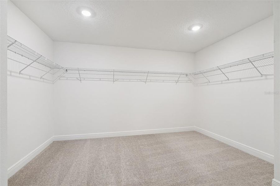 Spacious, unfurnished interior of a new home in The Reserve at Hammock Oaks - Signature Series, Lady Lake (Image 22).