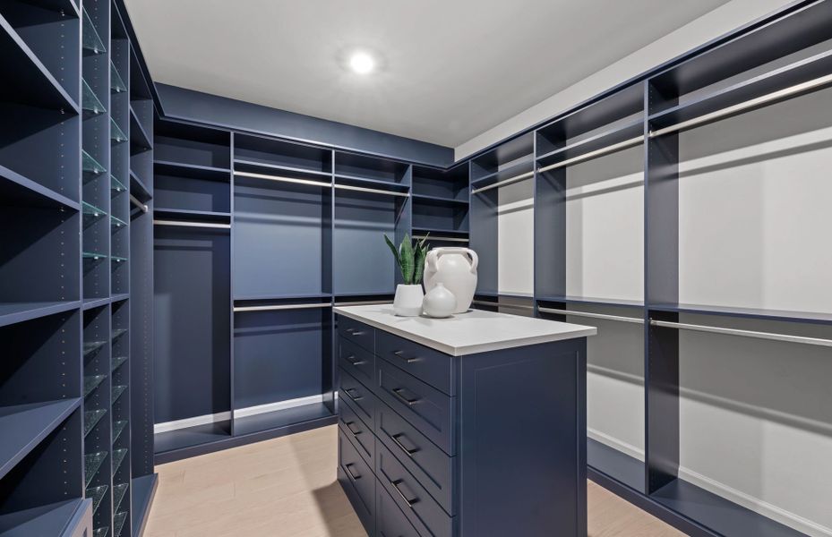Walk-in closet with storage located at Owner's suite Walk-in closet with storage located at Owner's suite