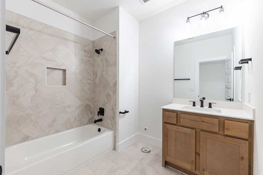 Full bathroom with vanity and shower / washtub combination