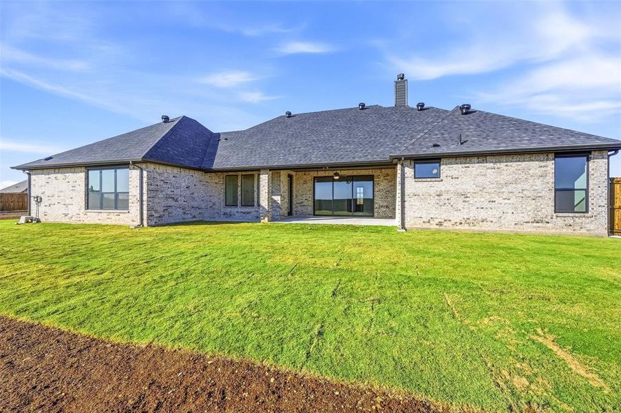 Exterior details and patio area of a home in Coyote Crossing, Godley (Image 3).