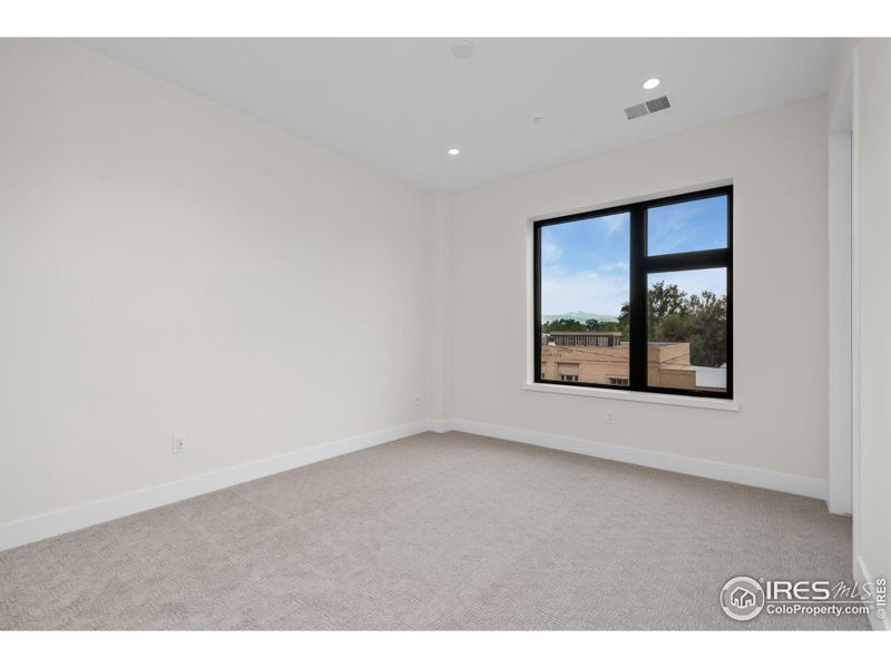 Secondary bedroom includes an ensuite and walk-in closet