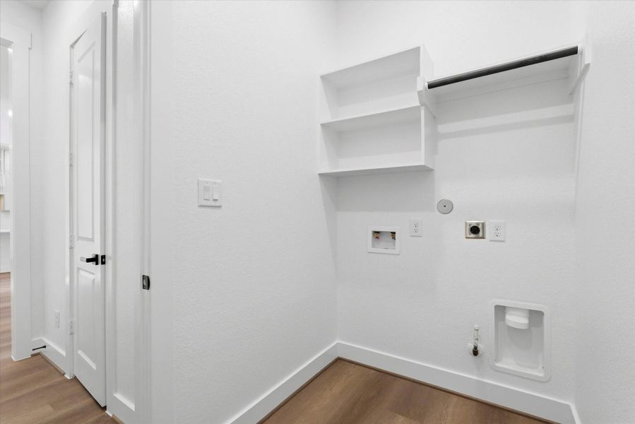 A conveniently located downstairs laundry room offers both gas and electric dryer connections.