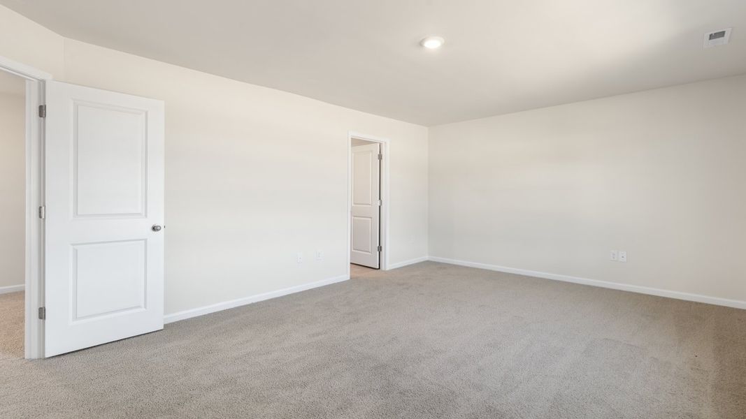 Spacious, unfurnished interior of a new home in The Grove at Matthews Landing, Fuquay Varina (Image 26).