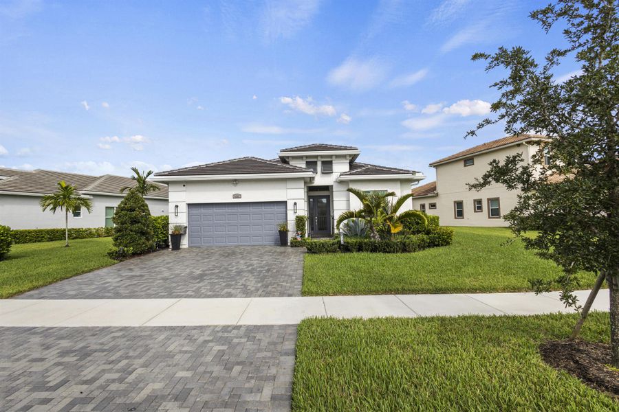 Front exterior of a new home in , Port St. Lucie, FL, highlighting curb appeal (Image 22).