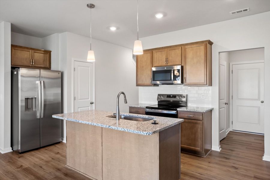 Furnished interior view inside a new home in West Main Townhomes, Sanford (Image 8).