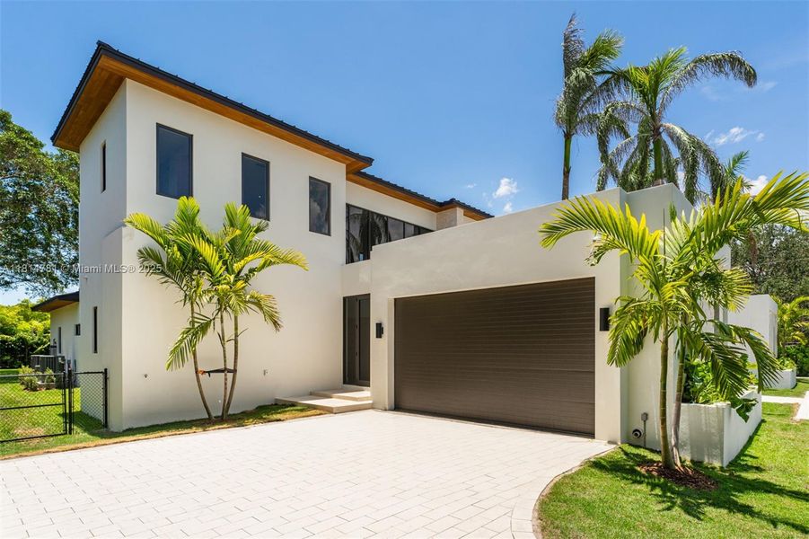Front exterior of a new home in , Pinecrest, FL, highlighting curb appeal (Image 40).
