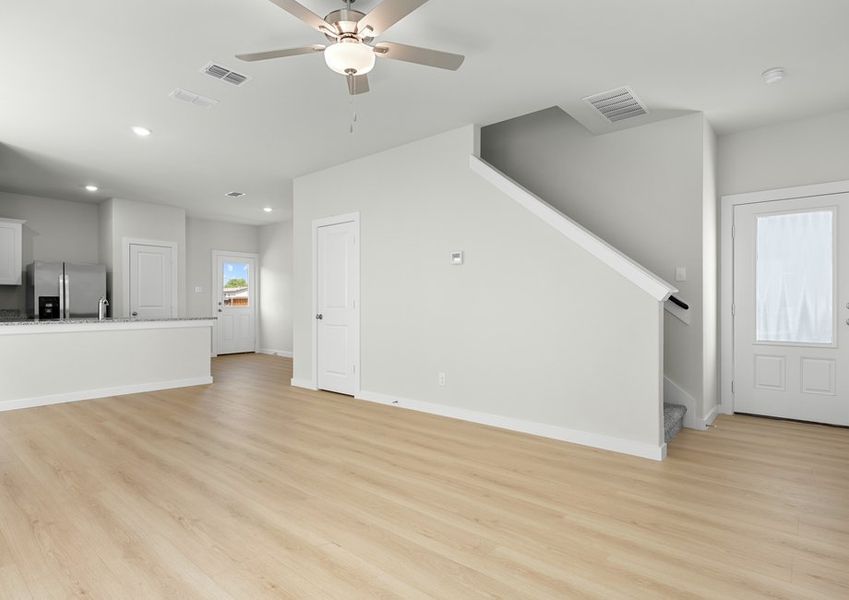 Open floor plan connects the living, dining and kitchen areas. Open floor plan connects the living, dining and kitchen areas.