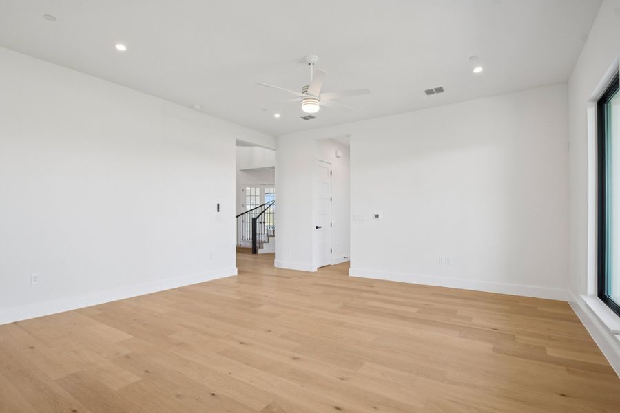 Spacious, unfurnished interior of a new home in Milky Way at River Place, Austin (Image 32).