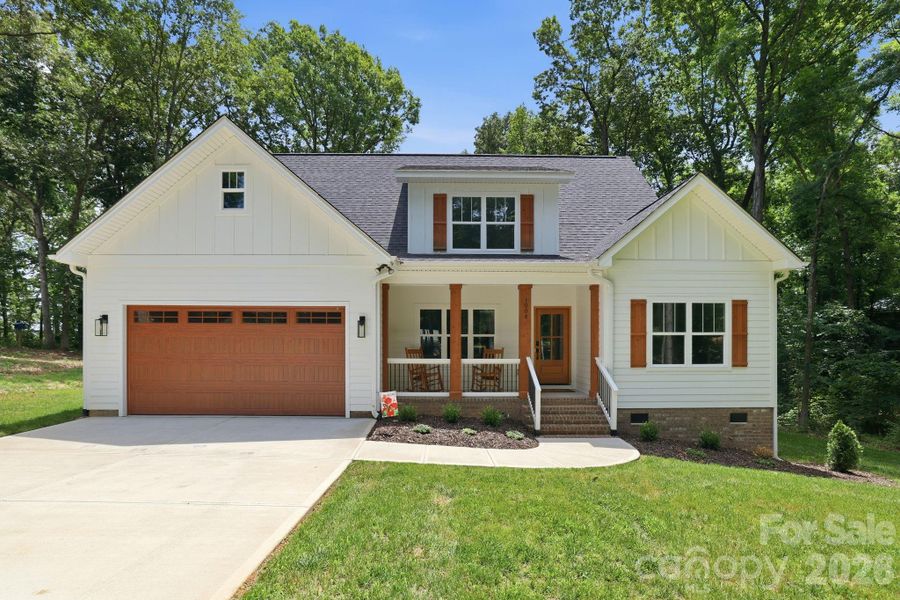 Front exterior of a new home in , Monroe, NC, highlighting curb appeal (Image 23).