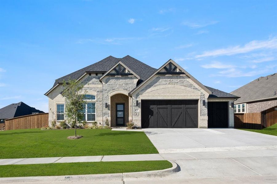 Front exterior of a new home in Hayes Crossing - Phase 2, Midlothian, TX, highlighting curb appeal (Image 1).