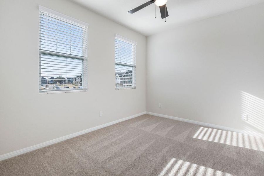 Unfurnished room with carpet and ceiling fan