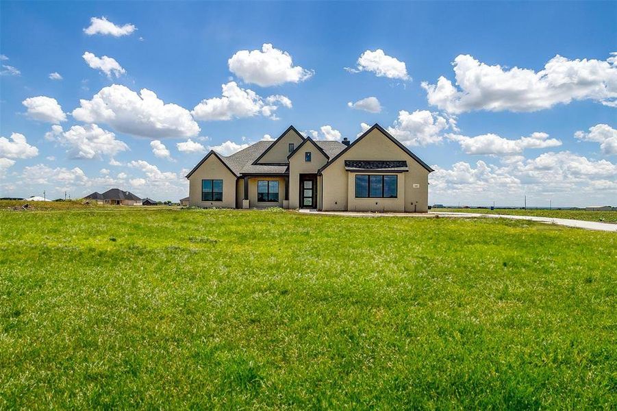 View of front of home with a front yard