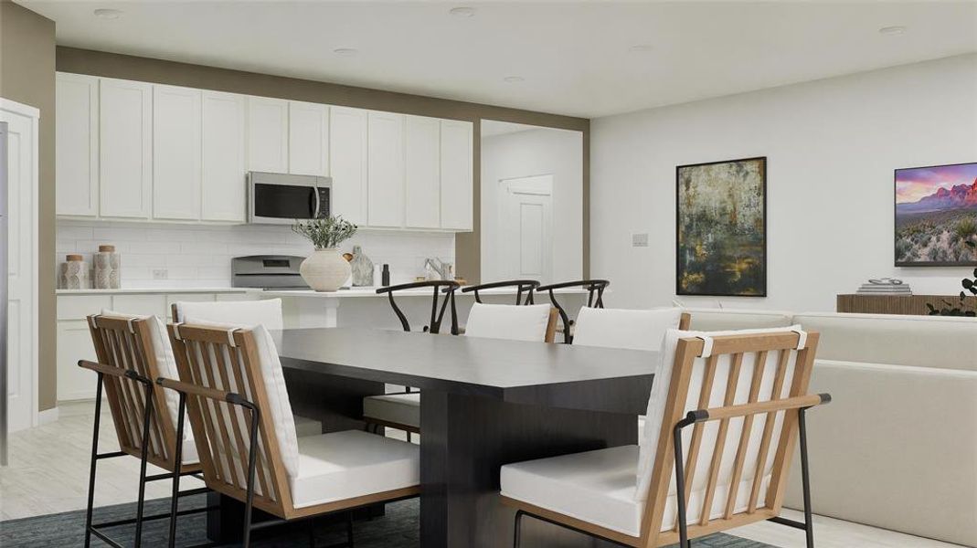 Dining room with light wood-style flooring