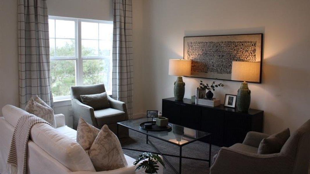 Representative furnished interior of a home built from the Altamont Townhome by D.R. Horton in Belcourt Landing, Cleveland (Image 4).