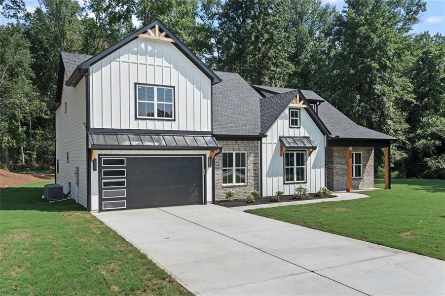 Front exterior of a new home in , Powder Springs, GA, highlighting curb appeal (Image 25). Front exterior of a new home in , Powder Springs, GA, highlighting curb appeal (Image 25).