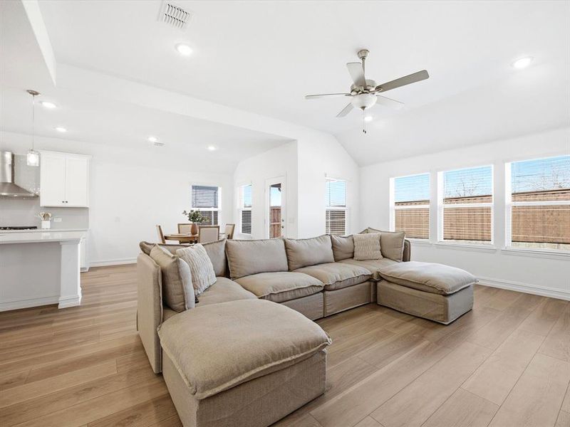 Living room view of single story three bedroom home with an office and a formal dining room