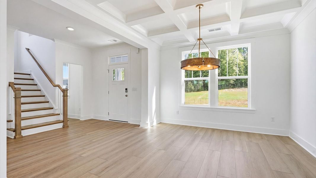 Thoughtful design meets architectural elegance in this coffered ceiling dining room near Woodruff, SC