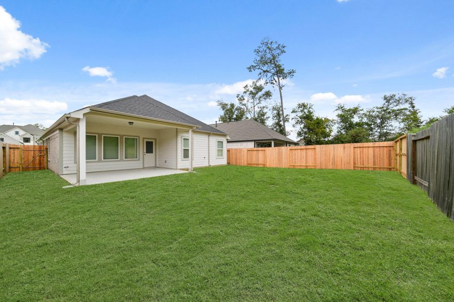 Front exterior of a new home in Barton Creek Ranch, Conroe, TX, highlighting curb appeal (Image 14). Front exterior of a new home in Barton Creek Ranch, Conroe, TX, highlighting curb appeal (Image 14).