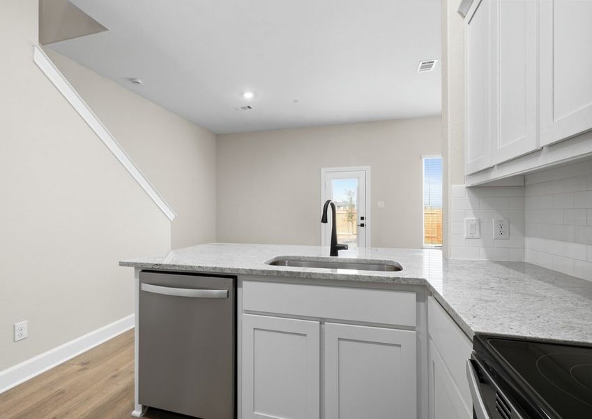 The kitchen looks out to the dining area.