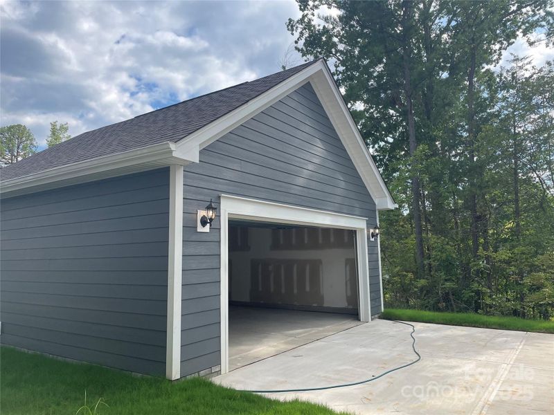 Front exterior of a new home in Arbor Village, Matthews, NC, highlighting curb appeal (Image 2).