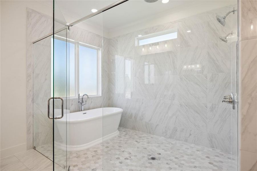 Bathroom featuring tile patterned flooring and separate shower and tub