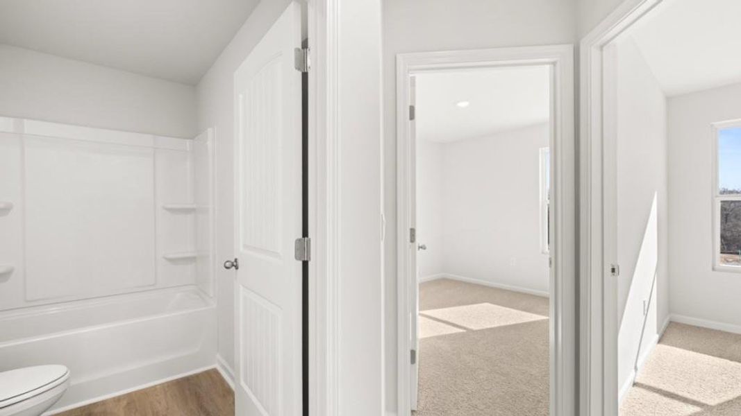 Spacious, unfurnished interior of a new home in Waypoint, Flowery Branch (Image 13).