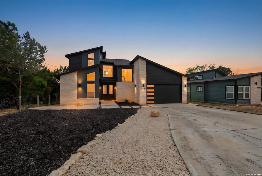 Front exterior of a new home in , Canyon Lake, TX, highlighting curb appeal (Image 22).