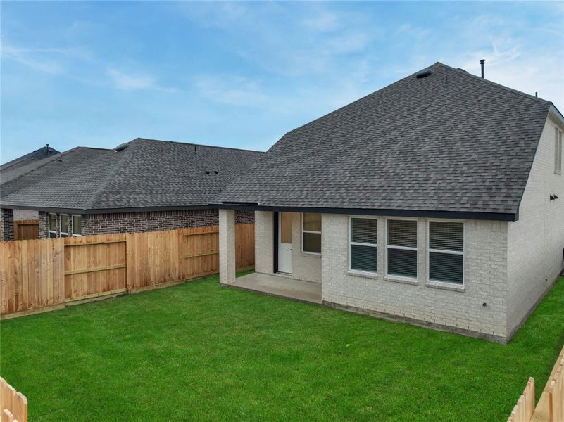 Exterior details and patio area of a home in Oakberry Trails, Waller (Image 27).