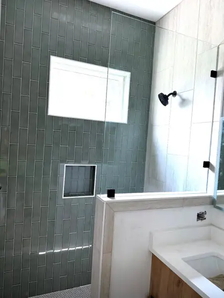 Primary walk in shower with a high window a shampoo niche Primary walk in shower with a high window a shampoo niche