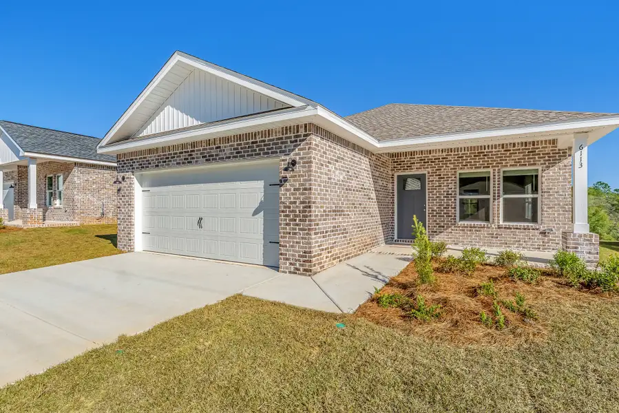 Front exterior of a new home in McCarthy Estates, Defuniak Springs, FL, highlighting curb appeal (Image 2). Front exterior of a new home in McCarthy Estates, Defuniak Springs, FL, highlighting curb appeal (Image 2).