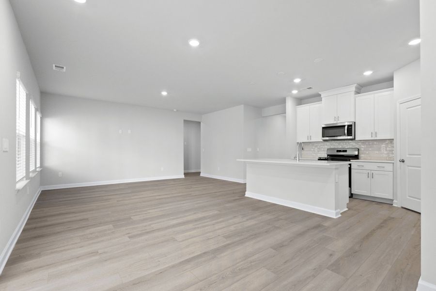 Spacious, unfurnished interior of a new home in Waterside - Coastline Series, Longs (Image 21).