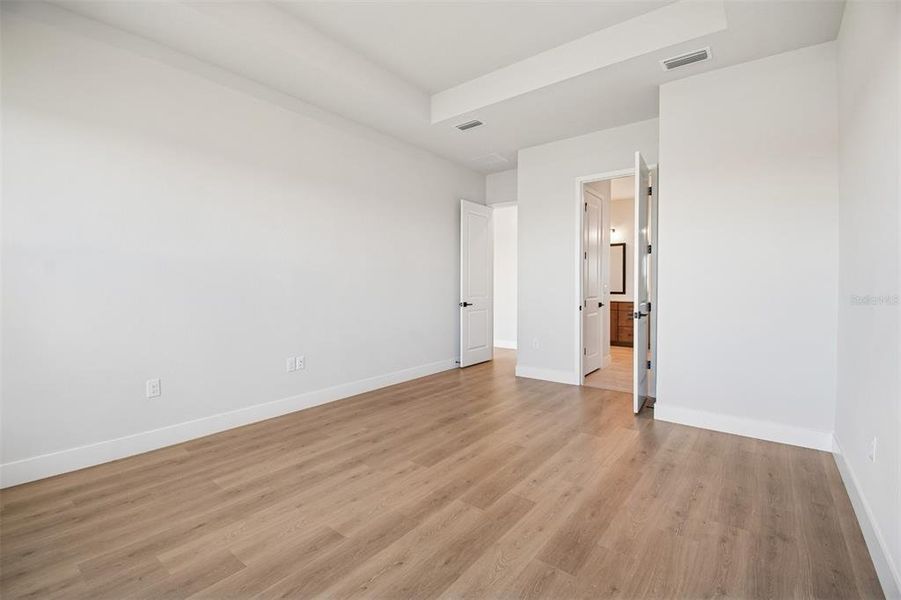 Spacious, unfurnished interior of a new home in Emerald Landing at Waterside at Lakewood Ranch – Lake Series, Sarasota (Image 22).