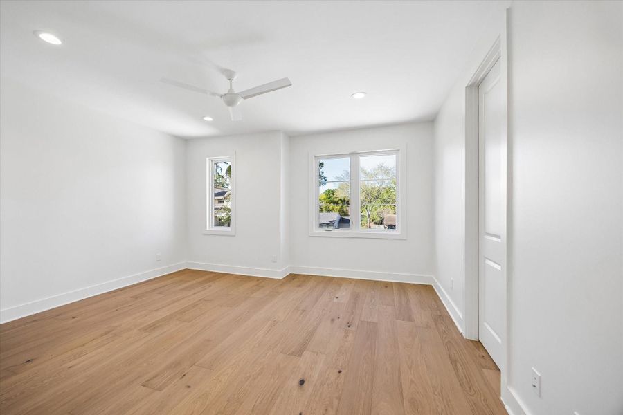 Bright upstairs bedroom features wide plank hardwood floors, recessed lighting, and dual windows that frame treetop views. Convenient access to the nearby bath and game room makes this space ideal for guests or everyday living.**PREVIOUS BUILDER WORK** Bright upstairs bedroom features wide plank hardwood floors, recessed lighting, and dual windows that frame treetop views. Convenient access to the nearby bath and game room makes this space ideal for guests or everyday living.**PREVIOUS BUILDER WORK**