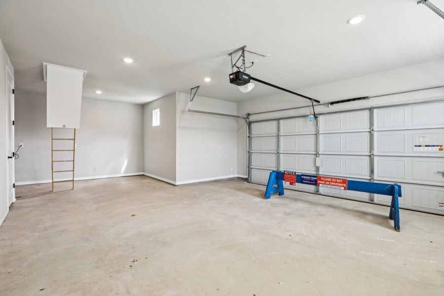 Garage with recessed lighting and a garage door opener Garage with recessed lighting and a garage door opener