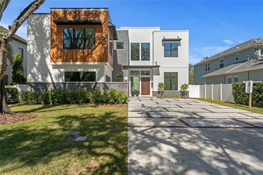 Front exterior of a new home in , Tampa, FL, highlighting curb appeal (Image 32).