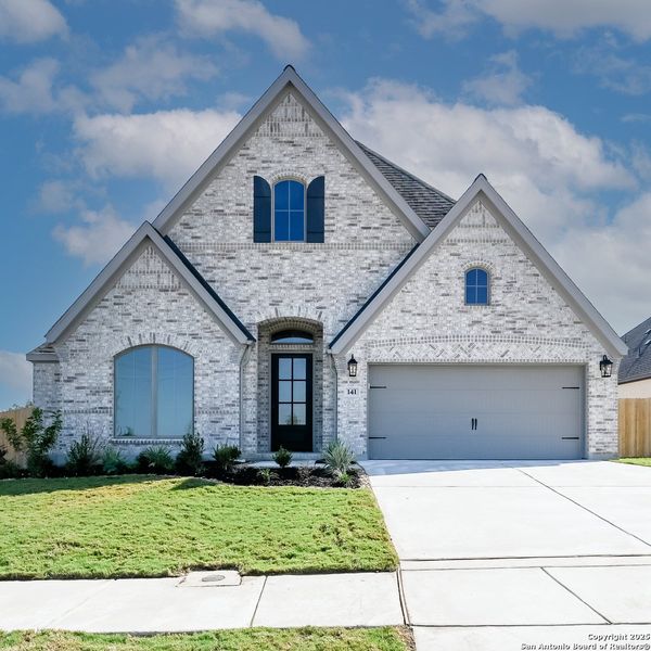 Front exterior of a new home in Cibolo Valley Heights 65', Cibolo, TX, highlighting curb appeal (Image 1). Front exterior of a new home in Cibolo Valley Heights 65', Cibolo, TX, highlighting curb appeal (Image 1).
