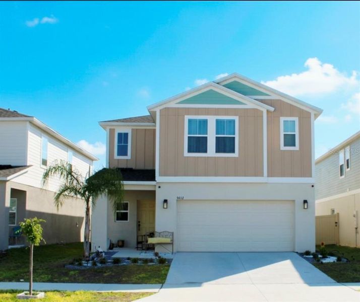 Front exterior of a new home in , Haines City, FL, highlighting curb appeal (Image 1). Front exterior of a new home in , Haines City, FL, highlighting curb appeal (Image 1).