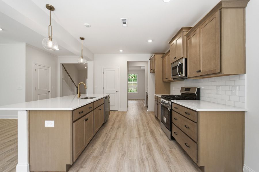 Furnished interior view inside a new home in Aden Woods, Fairview (Image 6).