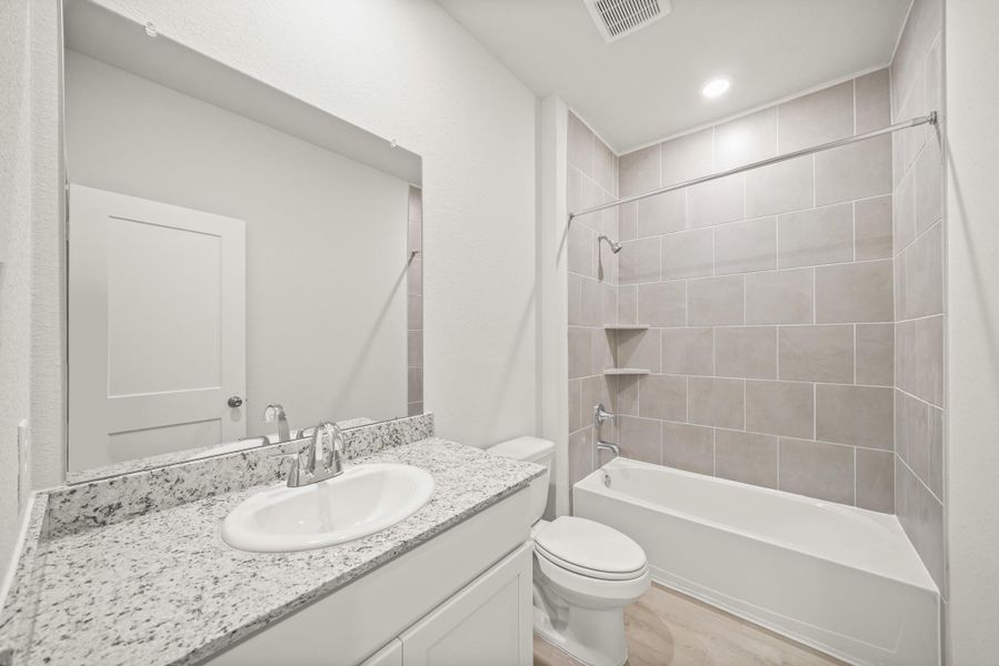 Furnished interior view inside a new home in Lakes at Crockett Martin, Conroe (Image 9).