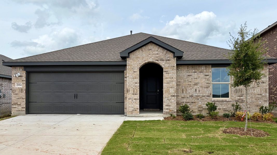 Front exterior of a new home in Northspur, Terrell, TX, highlighting curb appeal (Image 2). Front exterior of a new home in Northspur, Terrell, TX, highlighting curb appeal (Image 2).