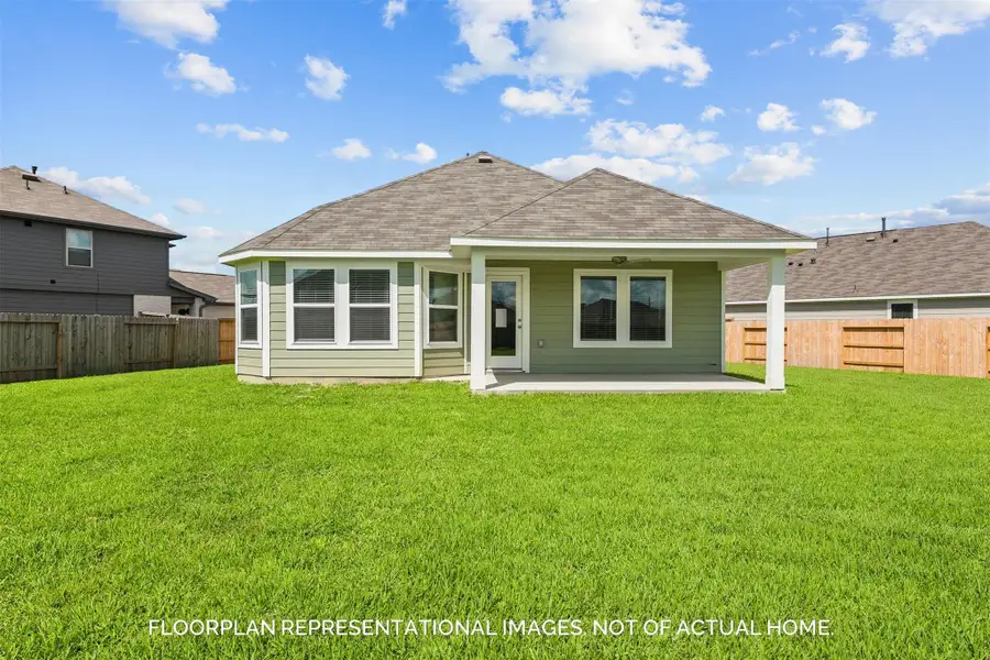 Front exterior of a new home in Magnolia Ridge, Magnolia, TX, highlighting curb appeal (Image 2).